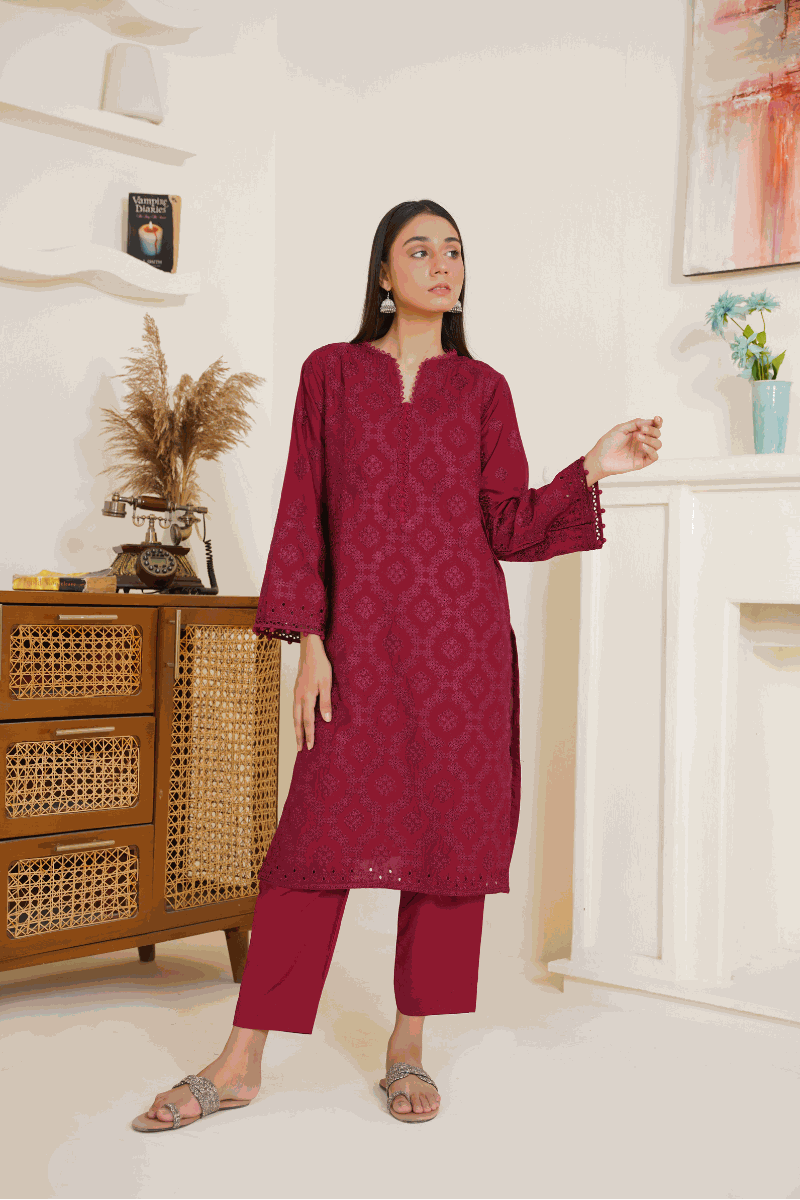 Woman modeling maroon ready to wear 03-piece lawn embroidered suit with shirt and trousers indoors